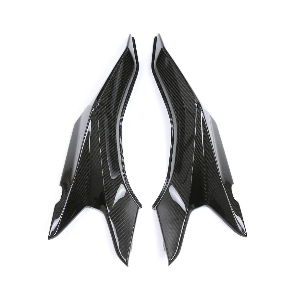 Angled View of BMW S1000XR Carbon Fiber Rider Seat Side Panels Angled View of BMW S1000XR Carbon Fiber Rider Seat Side Panels